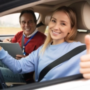 Driving instructor explaining road rules at AAA Car Driving School